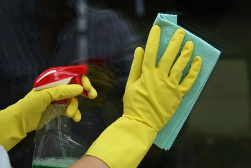 Cleaning professionals following a safety-focused procedure in a property
