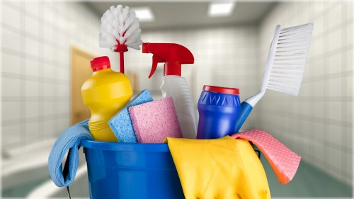 Cleaner in Uxbridge performing a deep clean in a bright bathroom